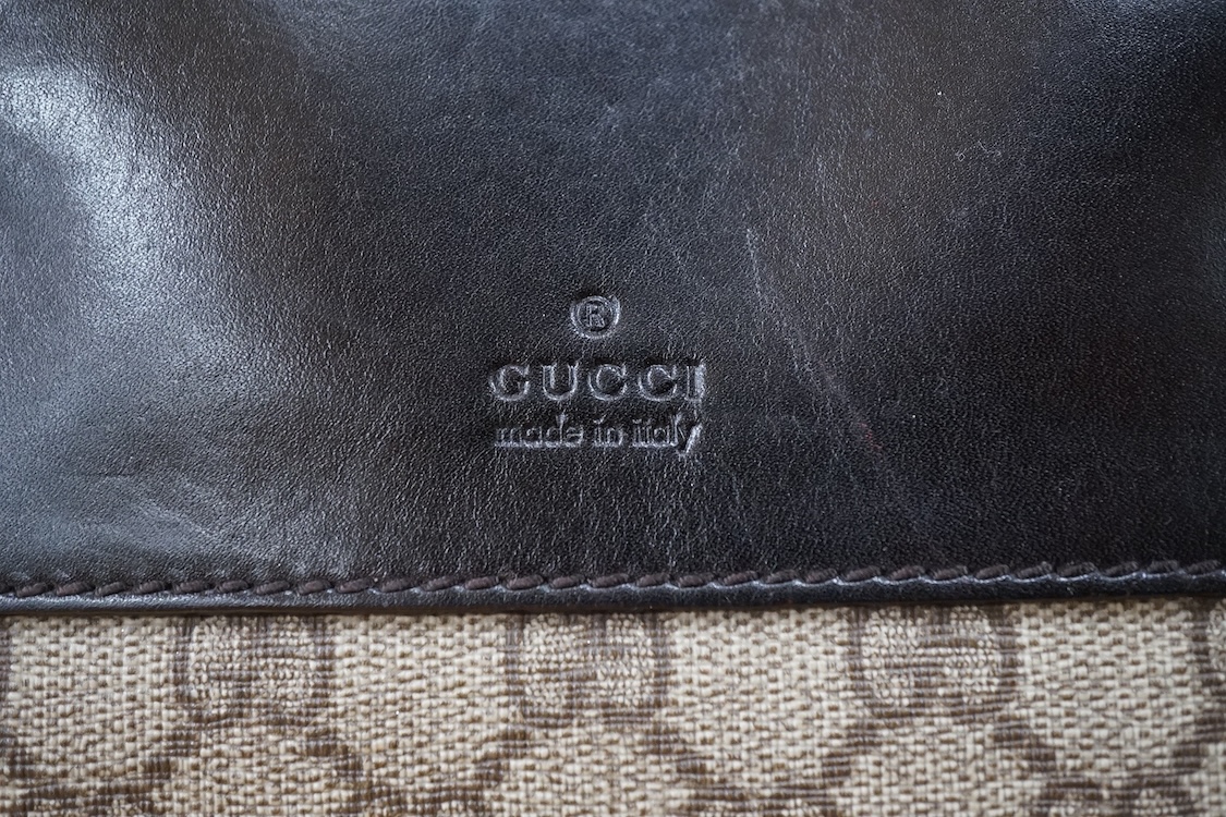 A Gucci supreme monogram travel case, 40cm wide